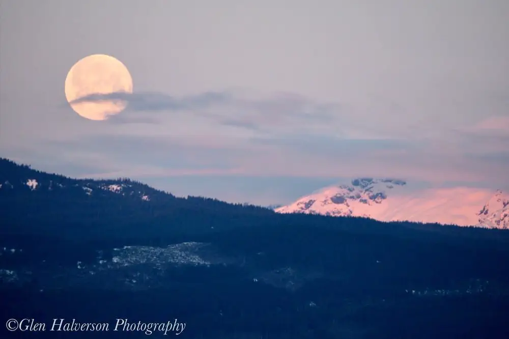 The full moon sets over the Comox Glacier.
