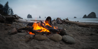 Close up photography of bonfire on beach sand