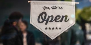 Shallow focus photo of white open sign