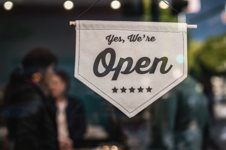 Shallow focus photo of white open sign