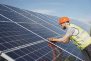 Young engineer checking maintenance of solar panels