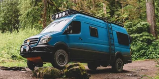 Sprinter van driving over rocks