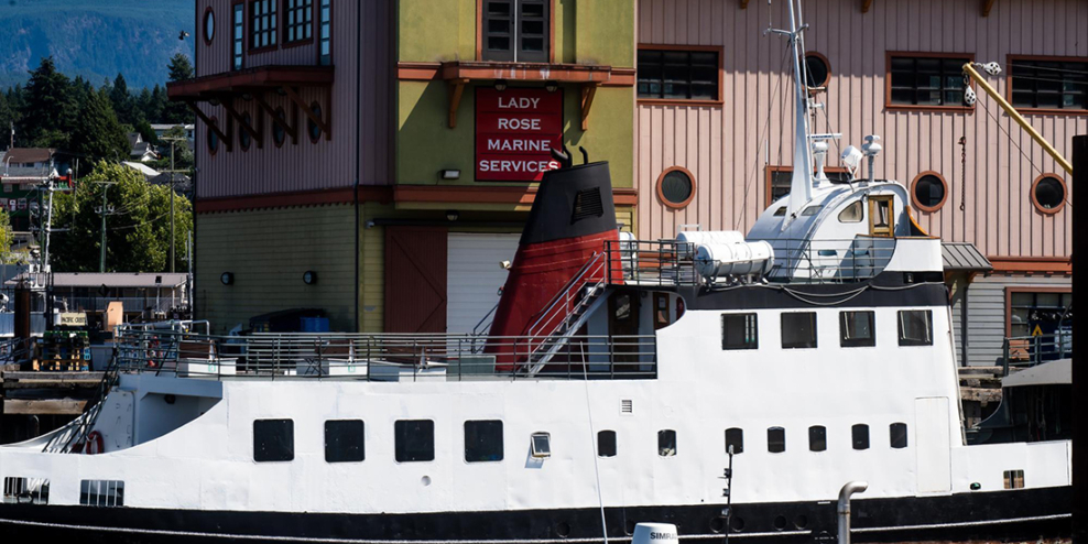 The MV Frances Barkley boat in front of the Lady Rose sign on a sunny day.