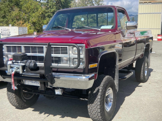 A classic Chevy Silverado with a black