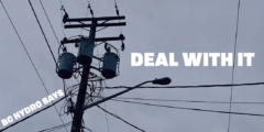 A closeup of a power pole with lots of wires and a street lamp on a cloudy day.