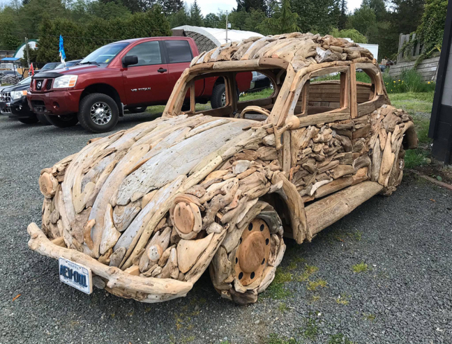 A Volkswagen Beetle made of driftwood.
