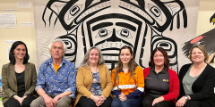 A group of representatives from BHP and North Island College sit together.