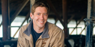 Farmer Doug Groenedijk gazes into the camera from his barn.