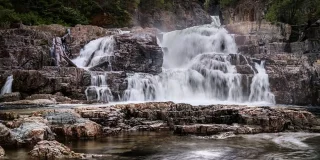 Myra Falls in Strathcona Park on a cloudy day.