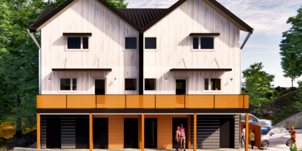 A three-storey duplex under construction.