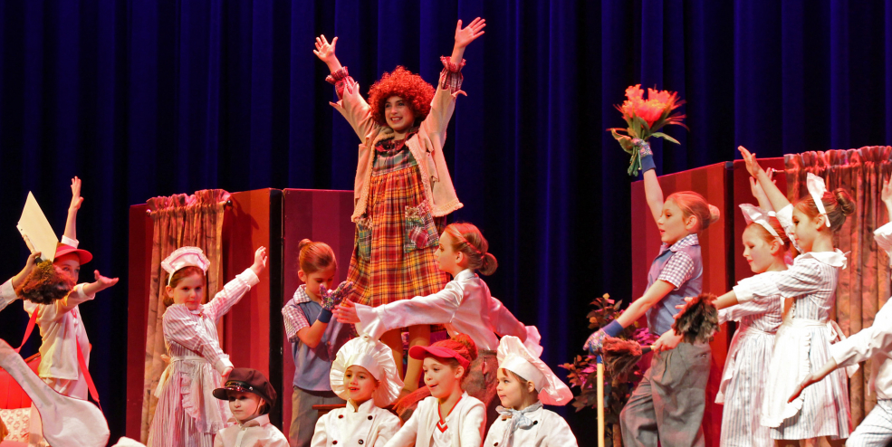 A group of kids perform in a Christmas-themed play.