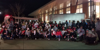 Students from 2021's food drive pose as a group.