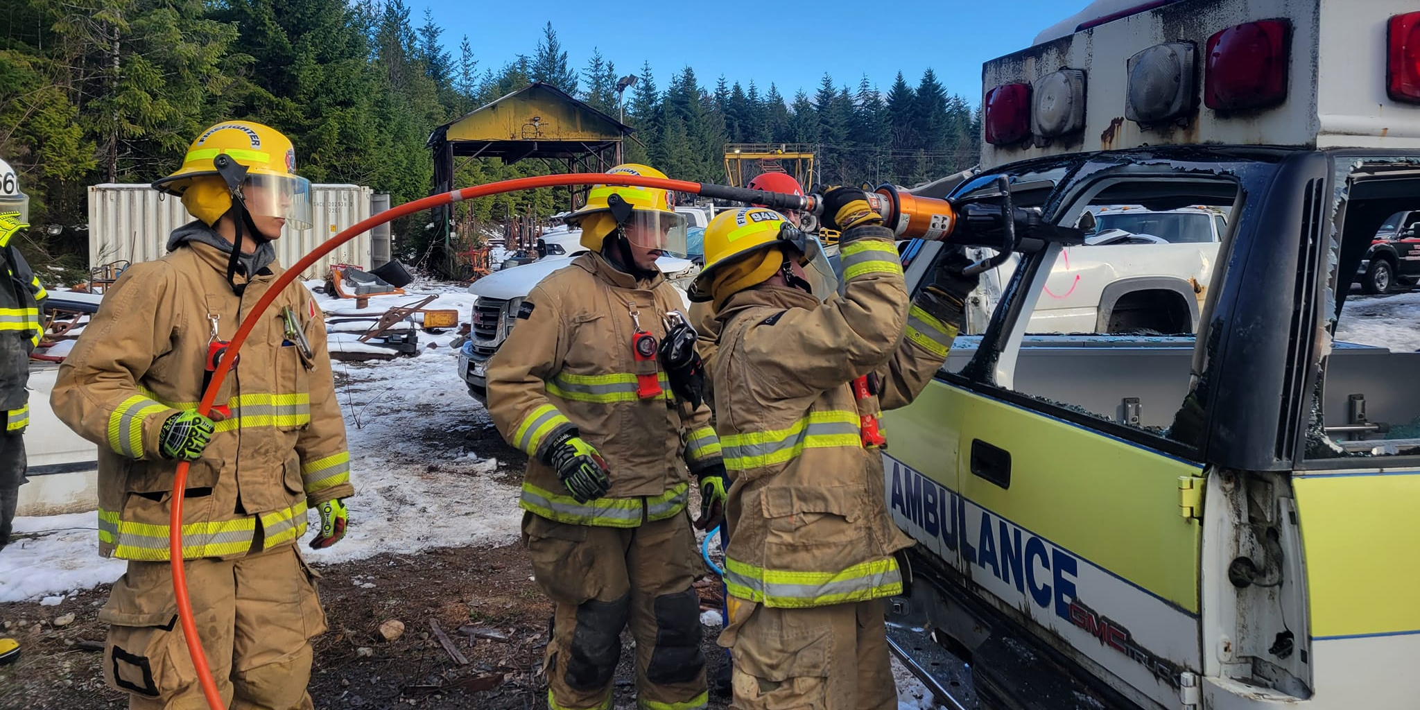 Volunteer firefighters learn how to extract someone from a damaged car.